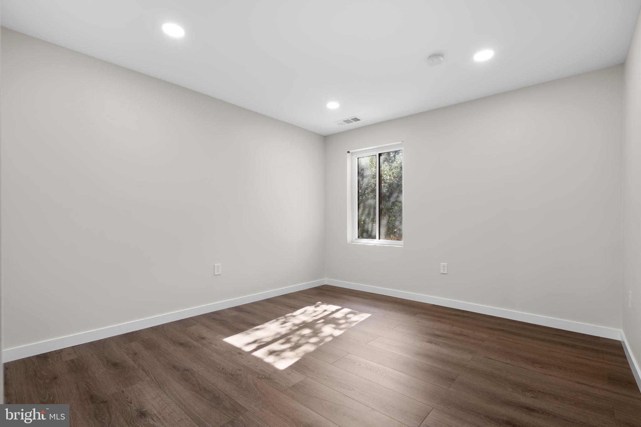 10053 Windstream Drive, Unit 3 Columbia, MD 21044 - Photo 17 of 30 a view of room with window and hardwood floor