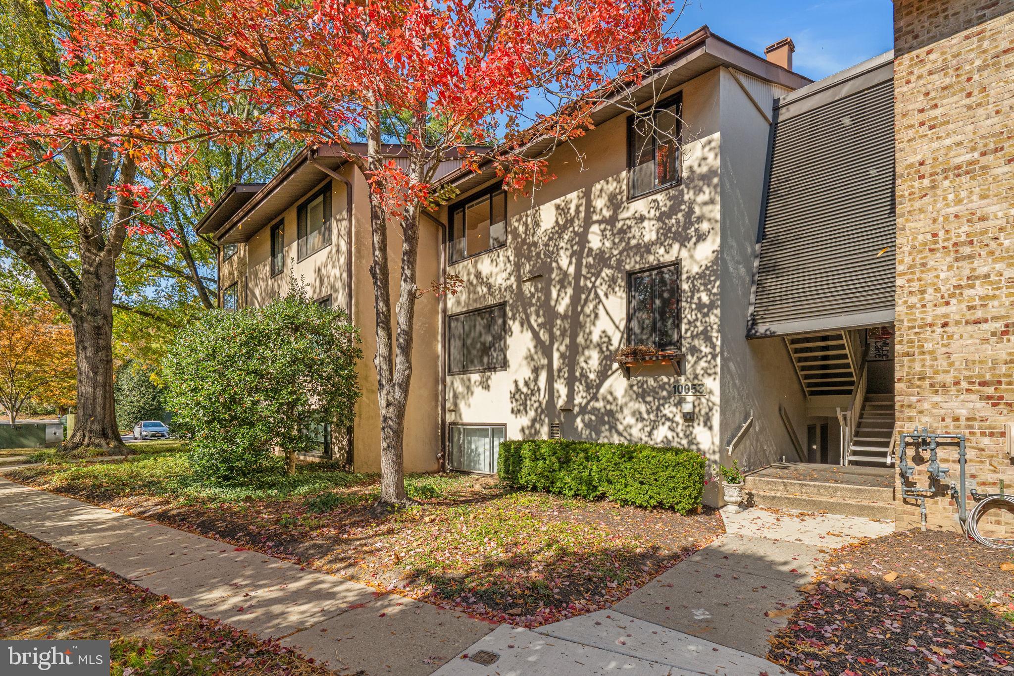 10053 Windstream Drive, Unit 3 Columbia, MD 21044 - Photo 2 of 30 a front view of a house with a yard