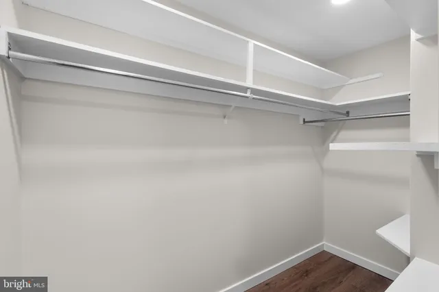a view of an empty walk in closet