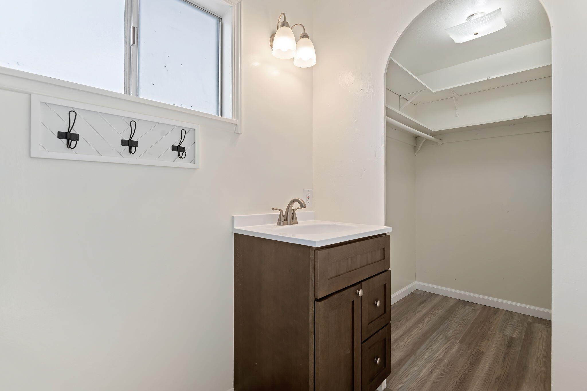 325 North J Street Oxnard, CA 93030 - Photo 18 of 25 a bathroom with a sink vanity and a mirror