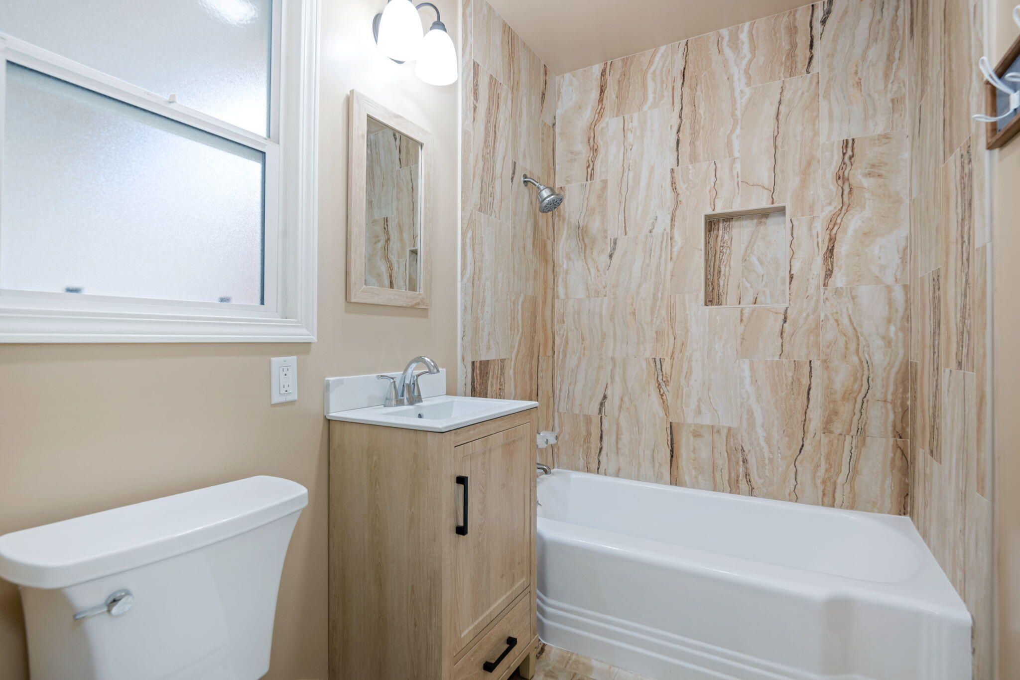 325 North J Street Oxnard, CA 93030 - Photo 21 of 25 a bathroom with a sink a toilet and bathtub