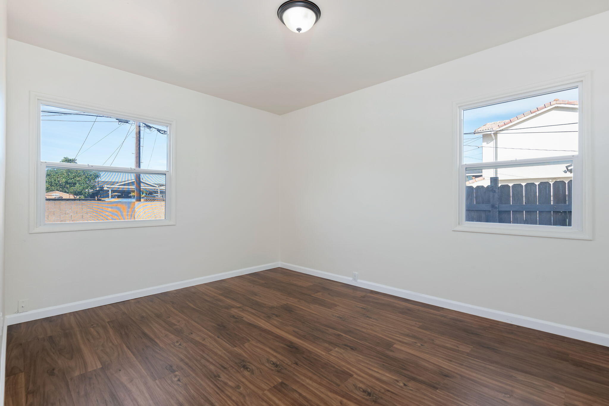 325 North J Street Oxnard, CA 93030 - Photo 22 of 25 a view of a room with wooden floor and windows
