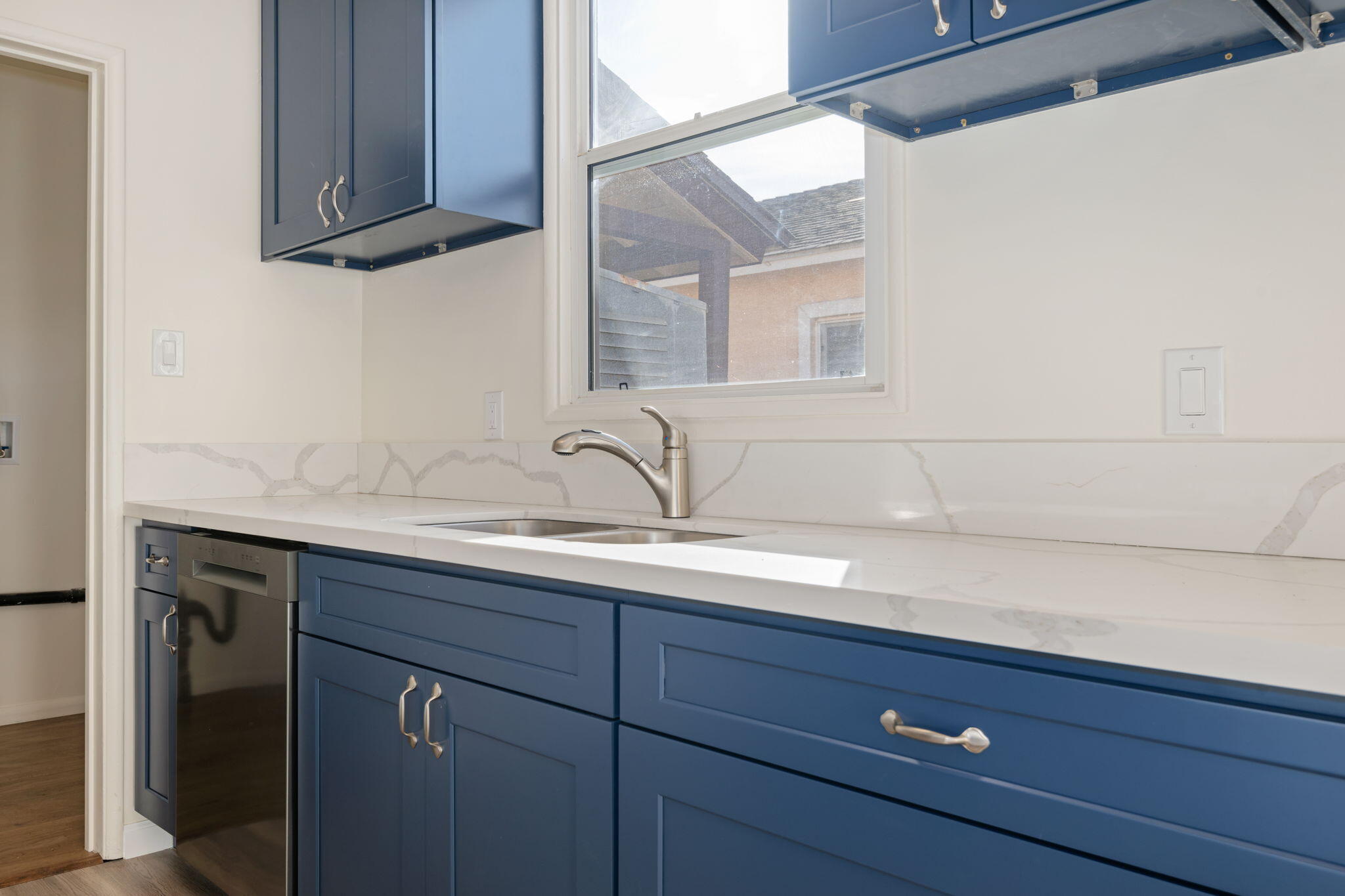 325 North J Street Oxnard, CA 93030 - Photo 9 of 25 a bathroom with a sink and a mirror