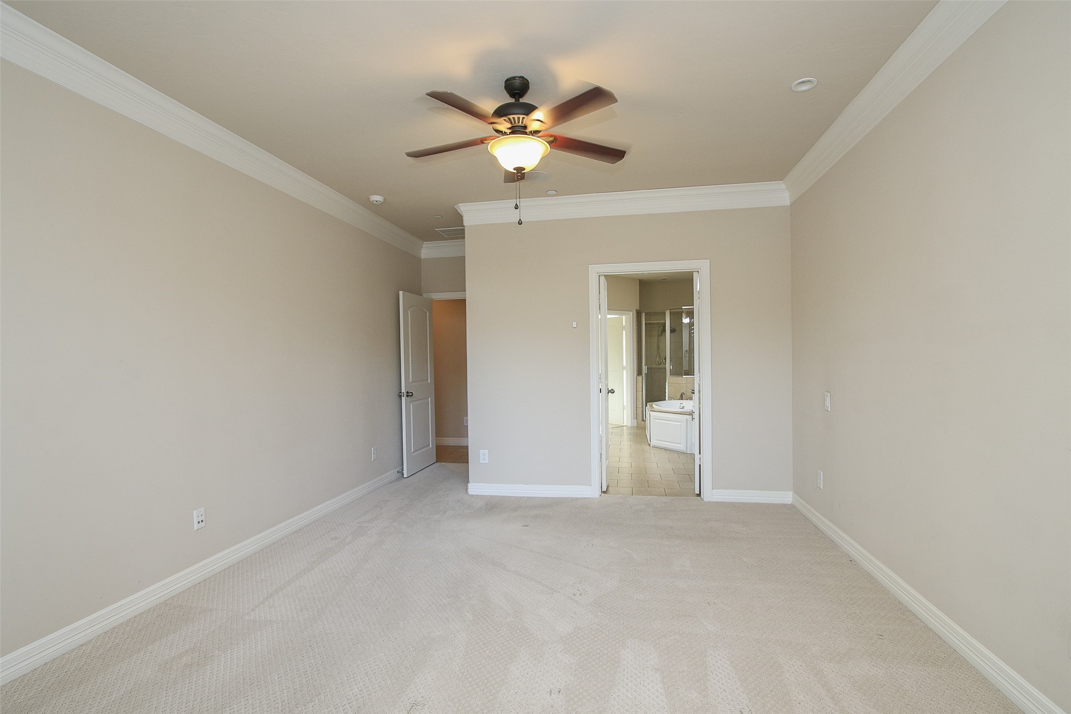 11722 Spriggs Way Houston, TX 77024 - Photo 23 of 49 Another view of the primary bedroom and the master bath is straight ahead.