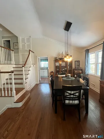 a view of a dining room with furniture window and wooden floor