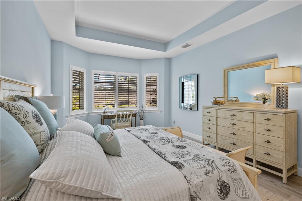 6359 Antigua Way Naples, FL 34113 - Photo 17 of 48 a bedroom with a bed and a dresser