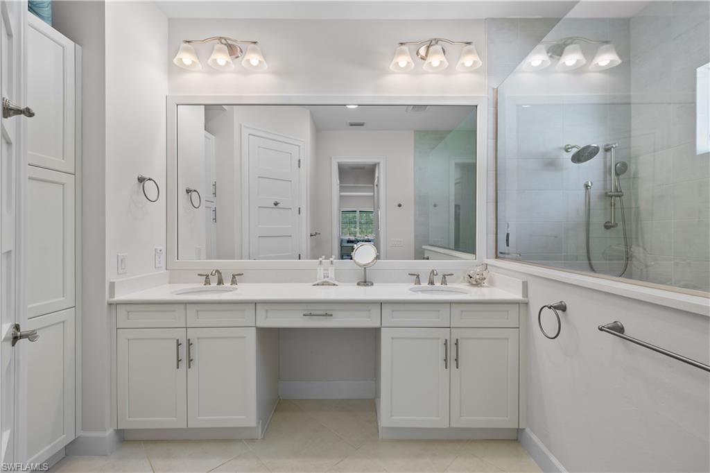 6359 Antigua Way Naples, FL 34113 - Photo 20 of 48 a bathroom with a sink double vanity and a mirror