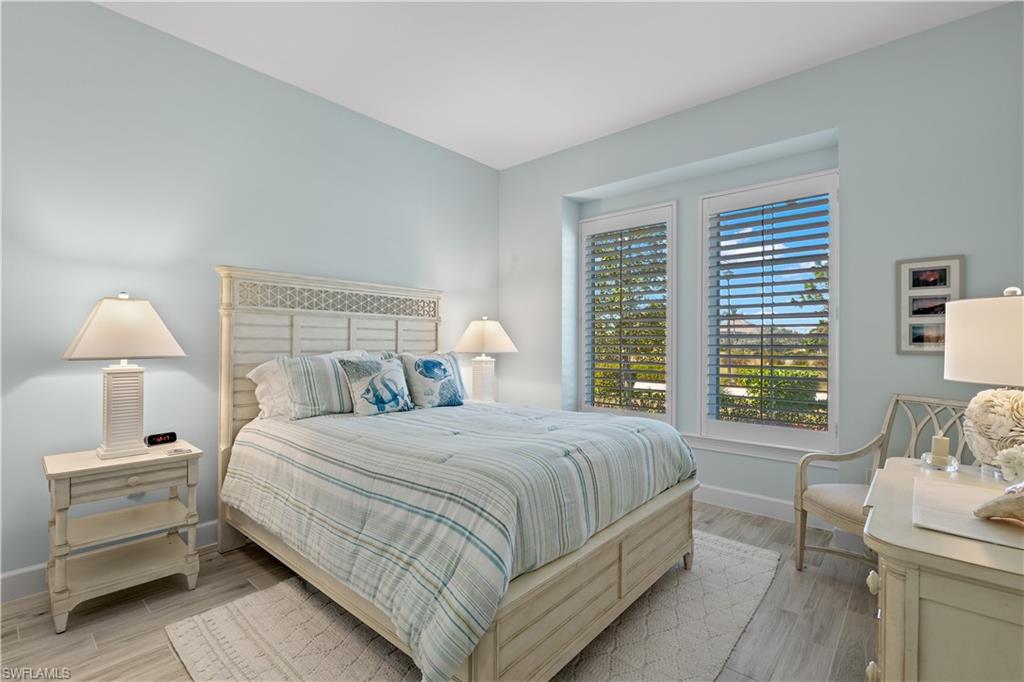 6359 Antigua Way Naples, FL 34113 - Photo 21 of 48 a bedroom with a bed and a window
