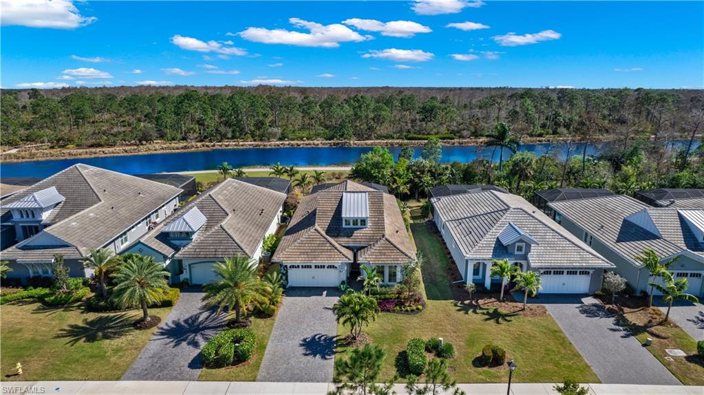 6359 Antigua Way Naples, FL 34113 - Photo 27 of 48 an aerial view of a house
