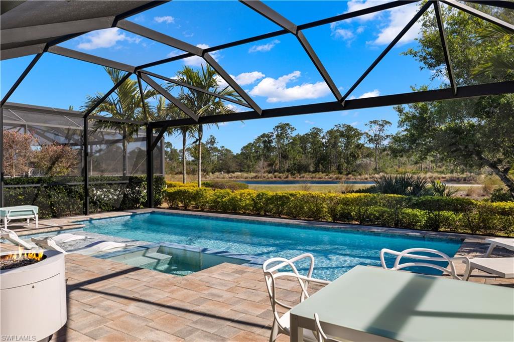6359 Antigua Way Naples, FL 34113 - Photo 28 of 48 a view of swimming pool with outdoor seating and yard