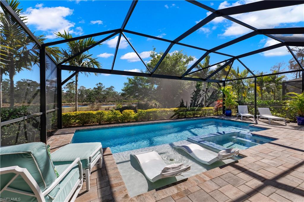 6359 Antigua Way Naples, FL 34113 - Photo 29 of 48 a view of an outdoor sitting area with furniture