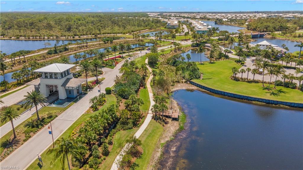 6359 Antigua Way Naples, FL 34113 - Photo 34 of 48 an aerial view of residential houses with outdoor space