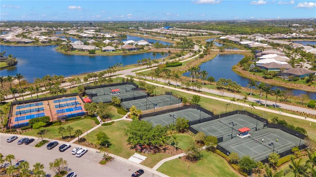 6359 Antigua Way Naples, FL 34113 - Photo 37 of 48 an aerial view of residential houses with outdoor space