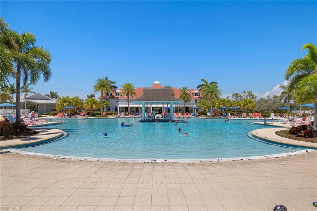 6359 Antigua Way Naples, FL 34113 - Photo 41 of 48 a front view of a house with garden