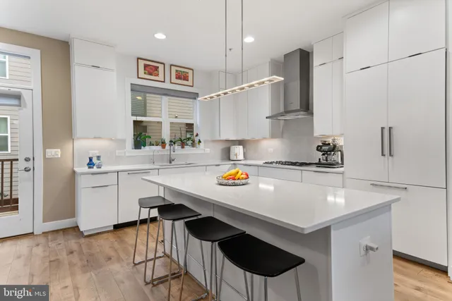 a kitchen with a sink cabinets and window