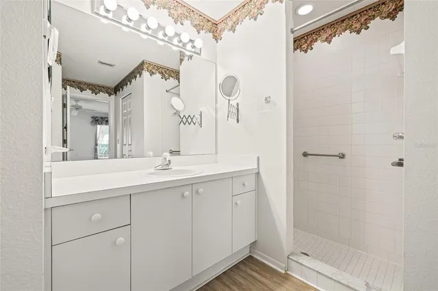 a bathroom with a double vanity sink and mirror