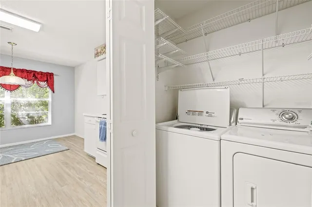 a view of a storage & utility room with washer and dryer