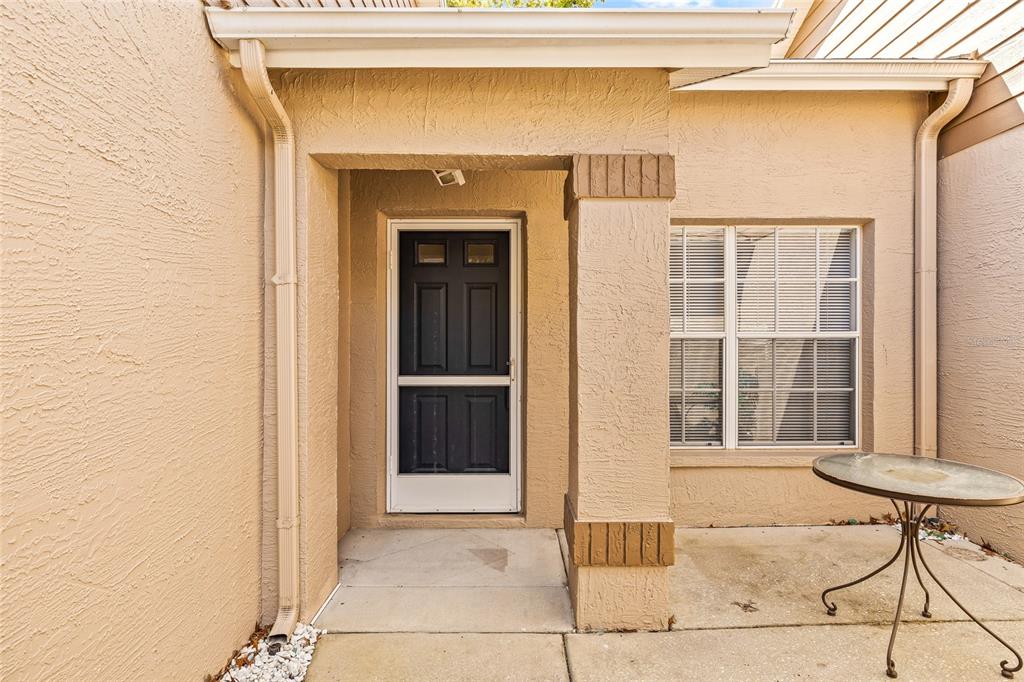 7343 Willowbrook Drive Spring Hill, FL 34606 - Photo 2 of 47 a view of entrance door of the house