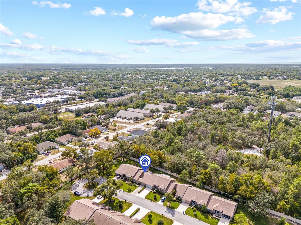 7343 Willowbrook Drive Spring Hill, FL 34606 - Photo 25 of 47 an aerial view of multiple house