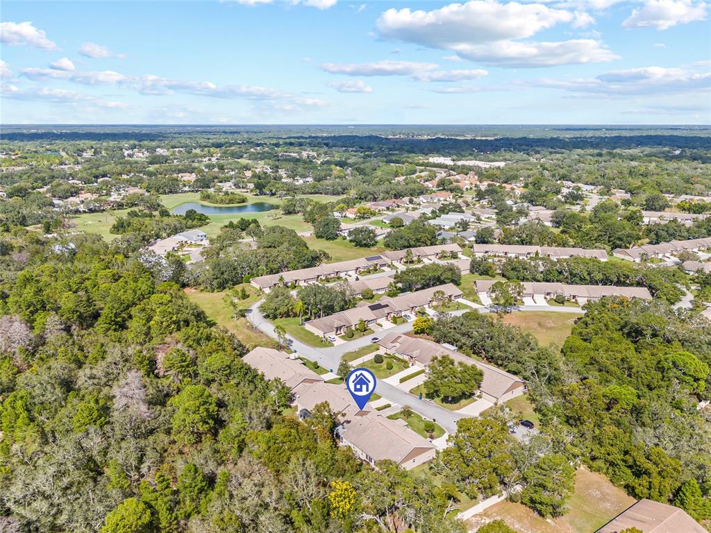 7343 Willowbrook Drive Spring Hill, FL 34606 - Photo 28 of 47 an aerial view of residential building with parking space