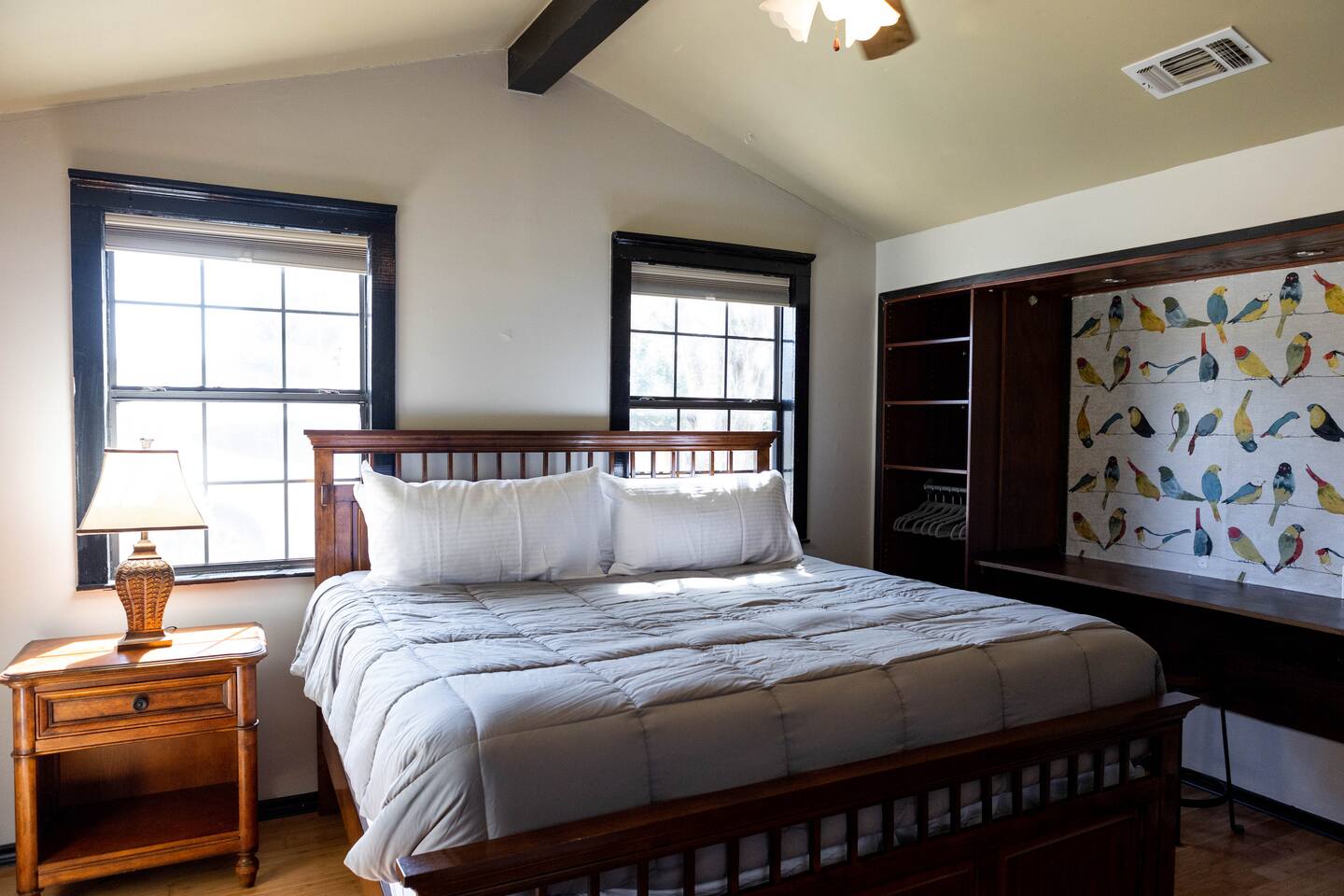 1901 Harmon Hills Road Dripping Springs, TX 78620 - Photo 12 of 27 Bedroom with wood finished floors, beam ceiling, and a ceiling fan