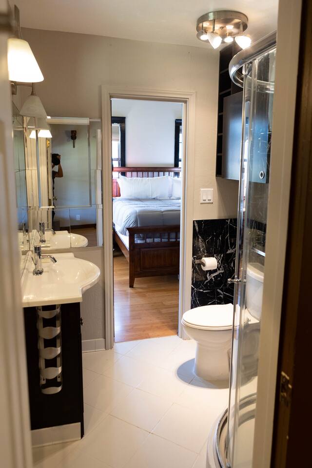 1901 Harmon Hills Road Dripping Springs, TX 78620 - Photo 7 of 27 Full bath with vanity, ensuite bath, a stall shower, and light tile patterned floors