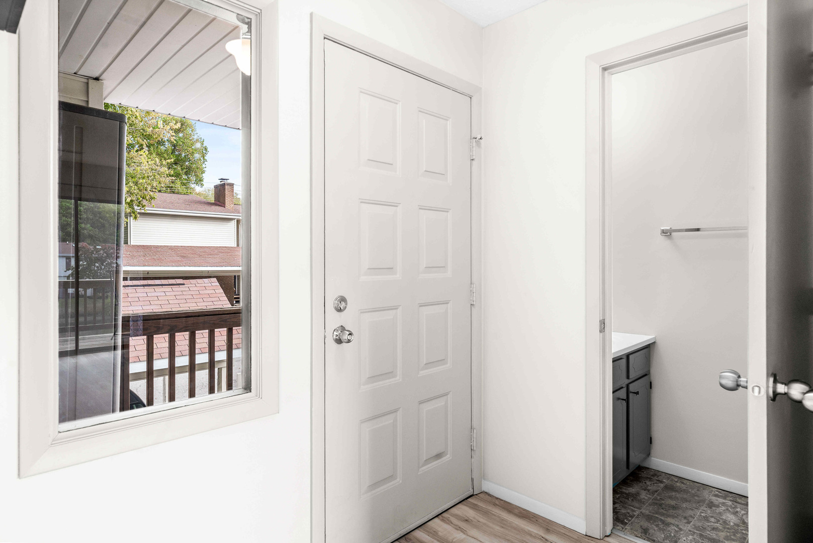 903 North Linden Street, Unit 17 Normal, IL 61761 - Photo 4 of 26 a view of a hallway with wooden floor and entryway