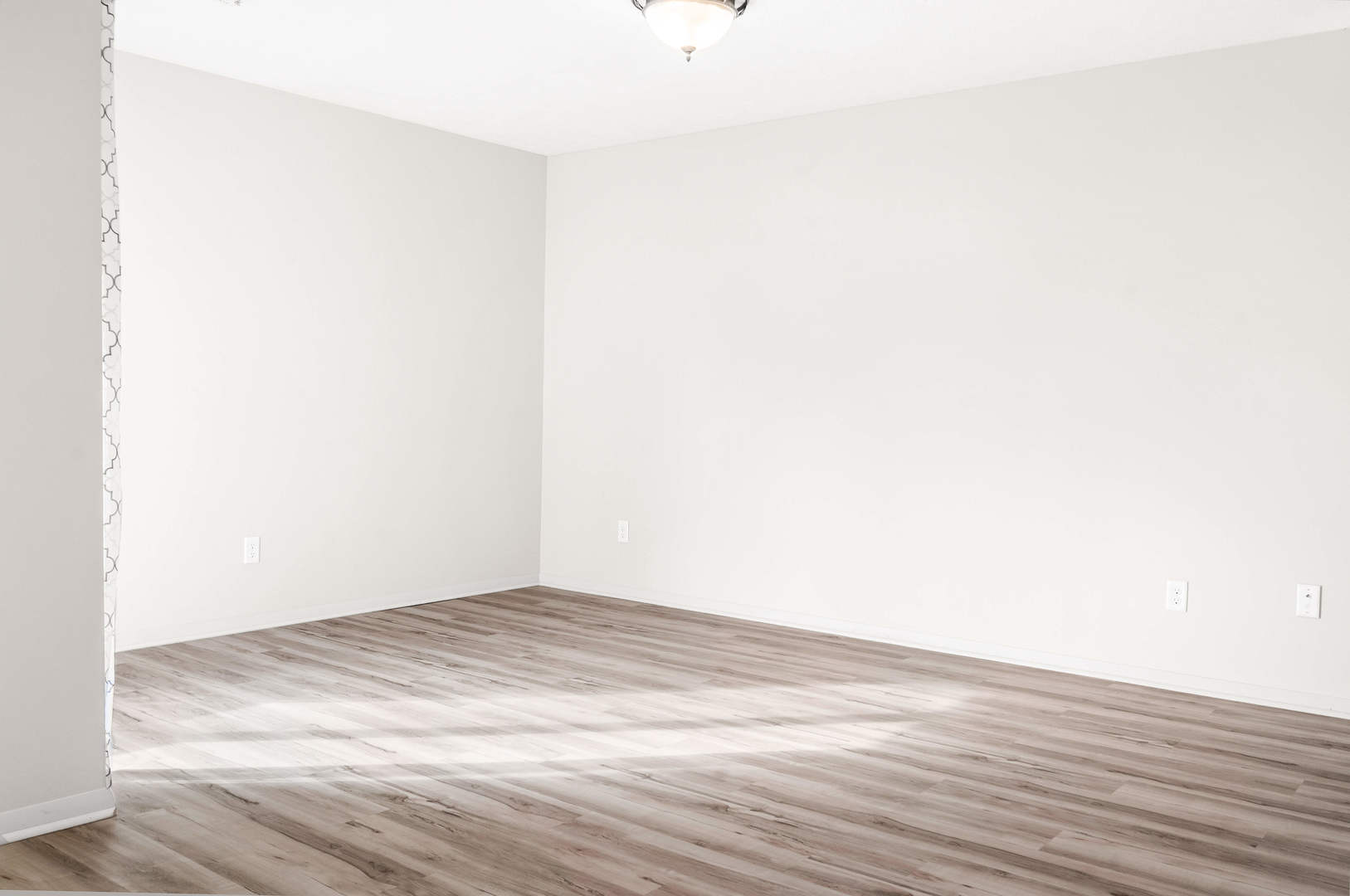 903 North Linden Street, Unit 17 Normal, IL 61761 - Photo 8 of 26 a view of empty room with wooden floor