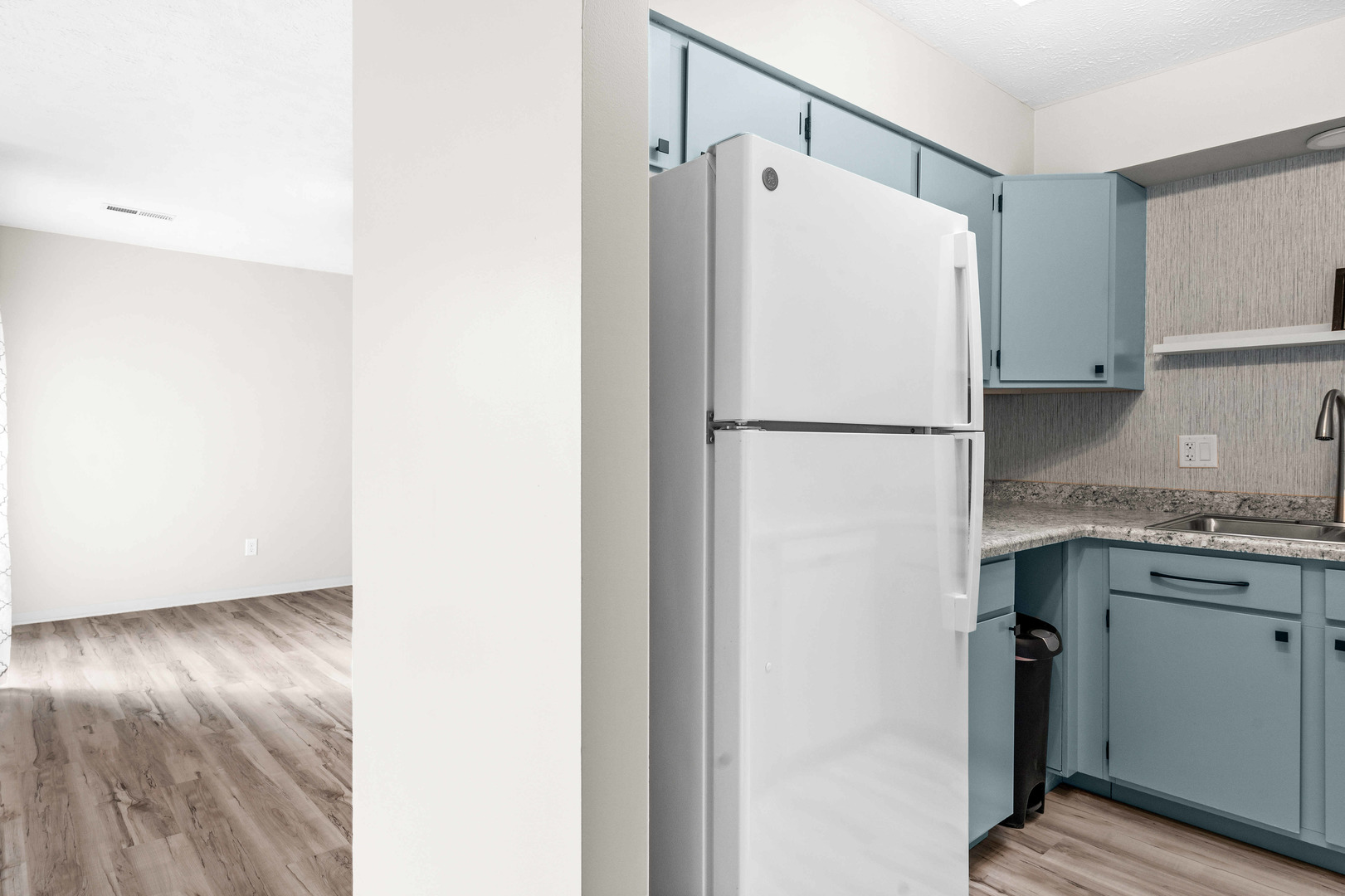903 North Linden Street, Unit 17 Normal, IL 61761 - Photo 9 of 26 a white refrigerator freezer sitting in a kitchen