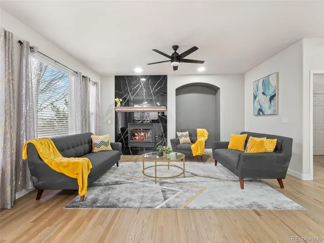 a living room with furniture and a large window