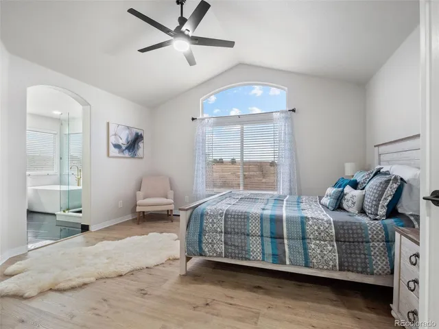 a spacious bathroom with a double vanity sink a mirror and a shower