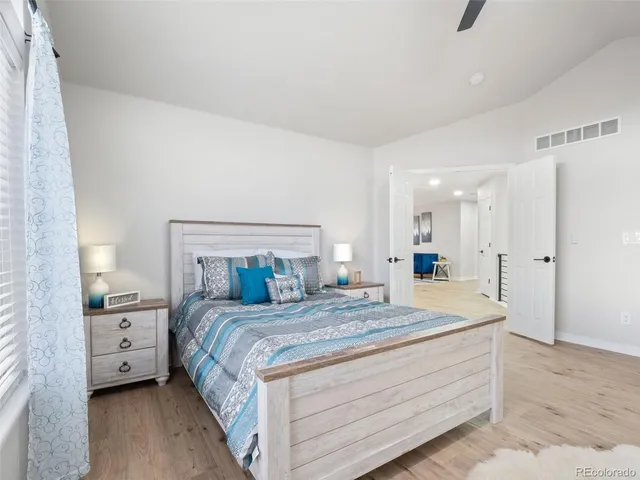 a bathroom with a double vanity sink mirror and bathtub