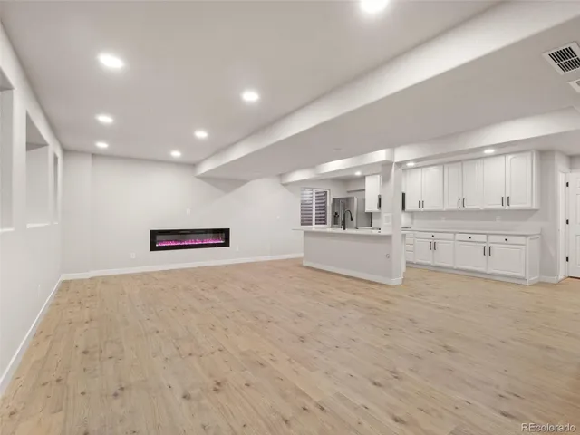 an empty room with a empty space and window