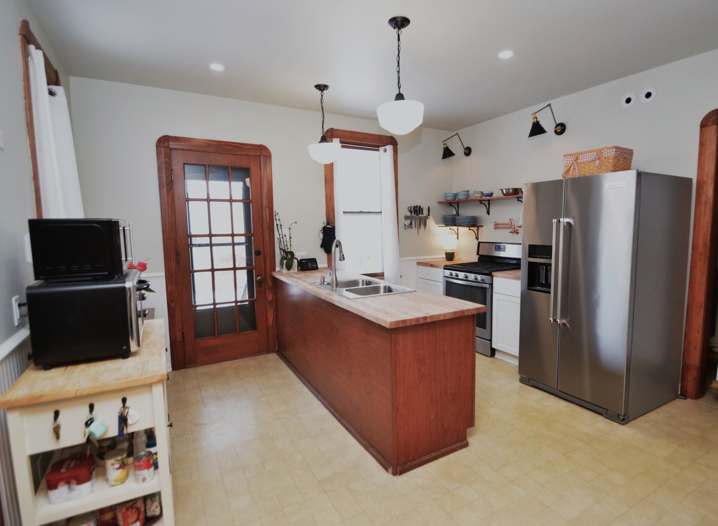 2626 Union Street Blue Island, IL 60406 - Photo 14 of 32 a kitchen with stainless steel appliances granite countertop a refrigerator a sink a stove and a refrigerator