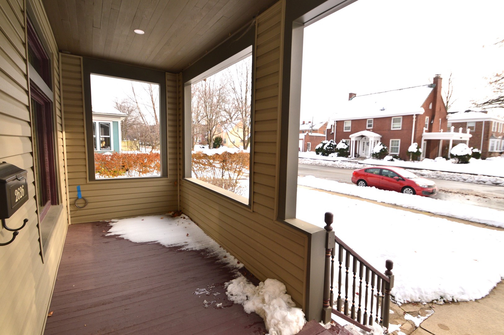 2626 Union Street Blue Island, IL 60406 - Photo 4 of 32 a view of a living room and a floor to ceiling window with wooden floor