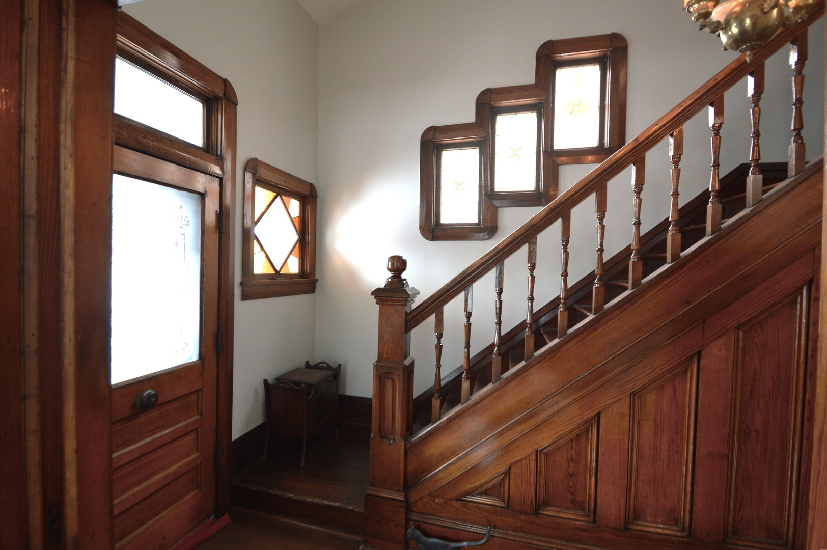 2626 Union Street Blue Island, IL 60406 - Photo 5 of 32 a view of staircase with lots of frames on wall and a window
