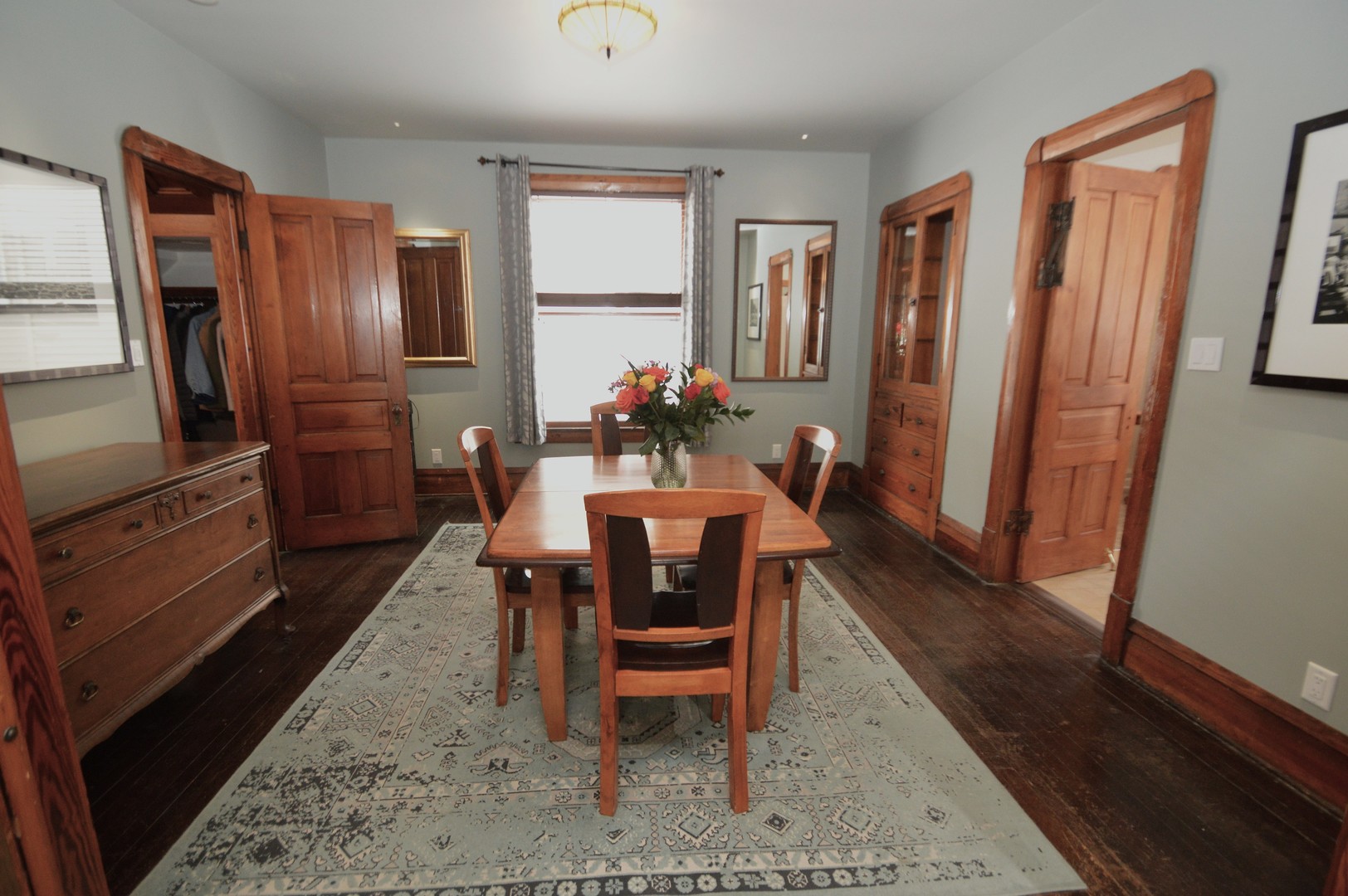 2626 Union Street Blue Island, IL 60406 - Photo 10 of 32 a dining room with furniture a rug and wooden floor
