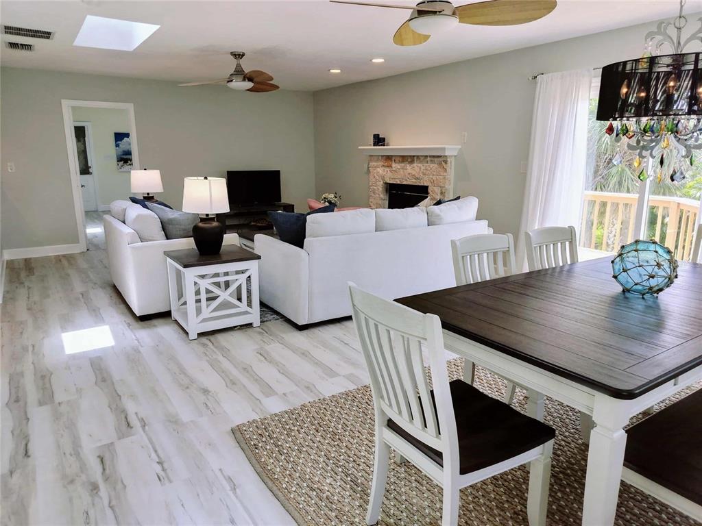 4766 South Atlantic Avenue Ponce Inlet, FL 32127 - Photo 11 of 32 a living room with furniture and a wooden floor