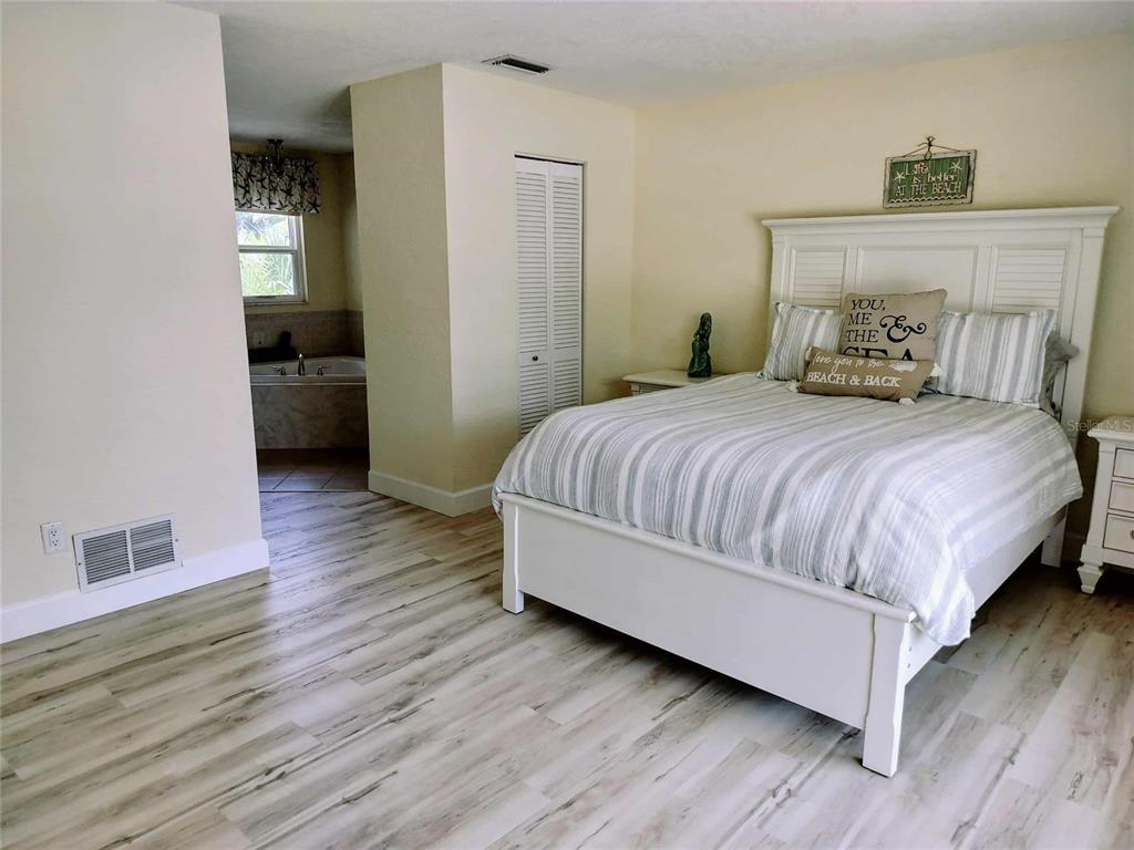 4766 South Atlantic Avenue Ponce Inlet, FL 32127 - Photo 15 of 32 a bedroom with a bed and a view of kitchen