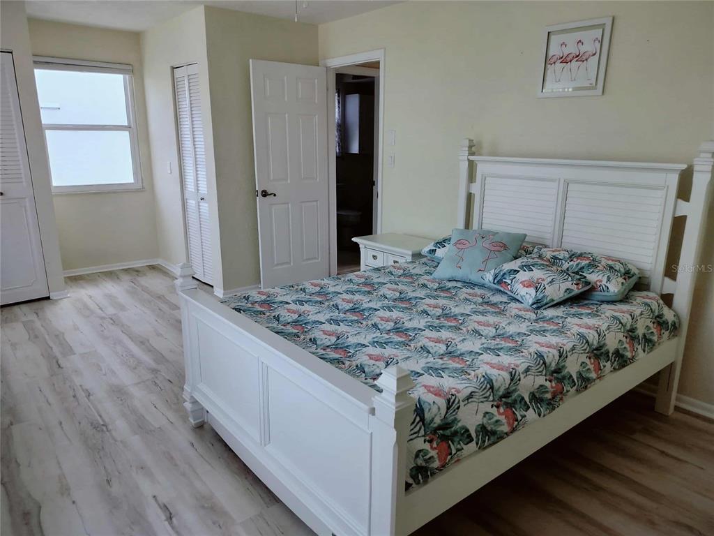 4766 South Atlantic Avenue Ponce Inlet, FL 32127 - Photo 22 of 32 a bedroom with a bed and a dresser