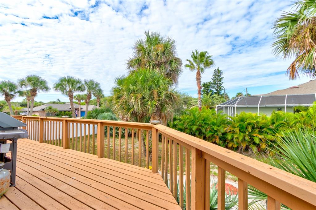 4766 South Atlantic Avenue Ponce Inlet, FL 32127 - Photo 25 of 32 a balcony with wooden floor and fence