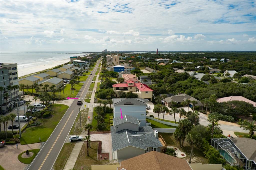 4766 South Atlantic Avenue Ponce Inlet, FL 32127 - Photo 30 of 32 an aerial view of a city with lots of residential buildings ocean and mountain view in back