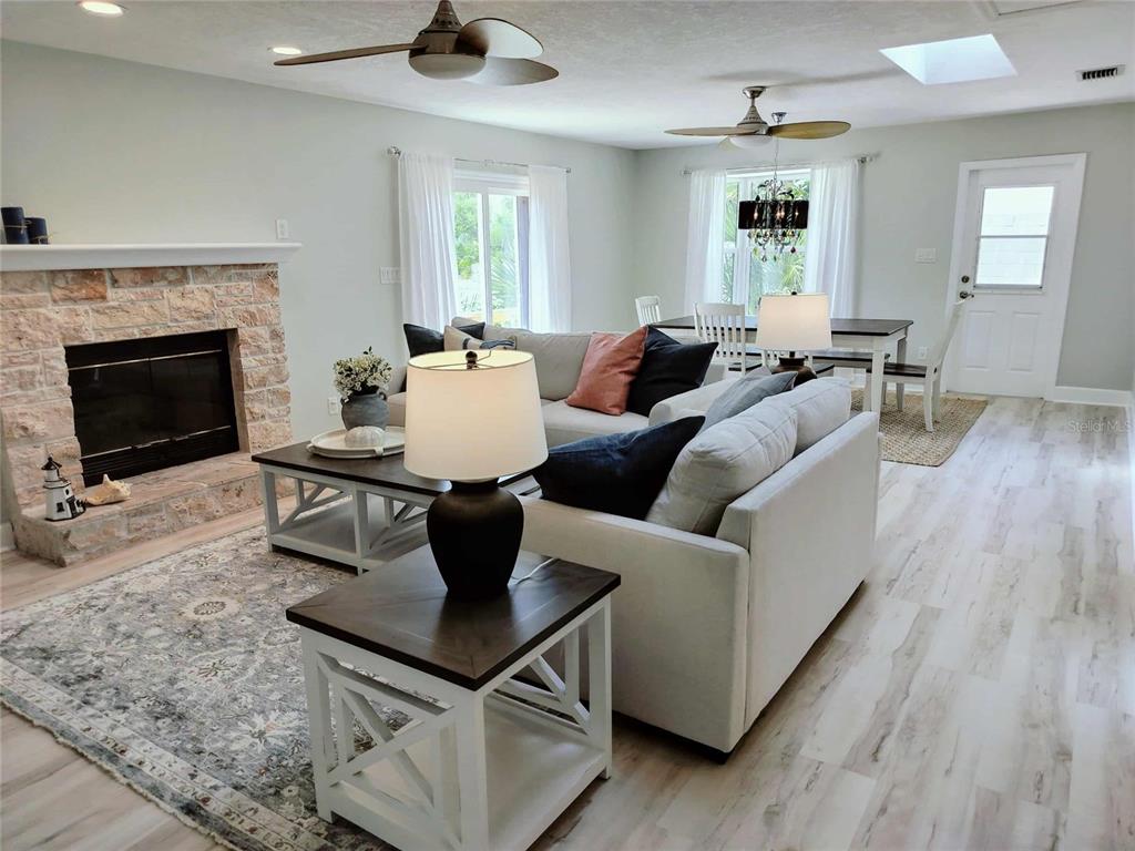 4766 South Atlantic Avenue Ponce Inlet, FL 32127 - Photo 10 of 32 a living room with furniture and a fireplace