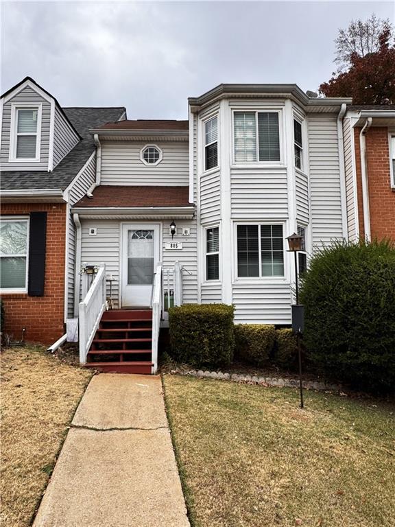 a front view of a house with stairs