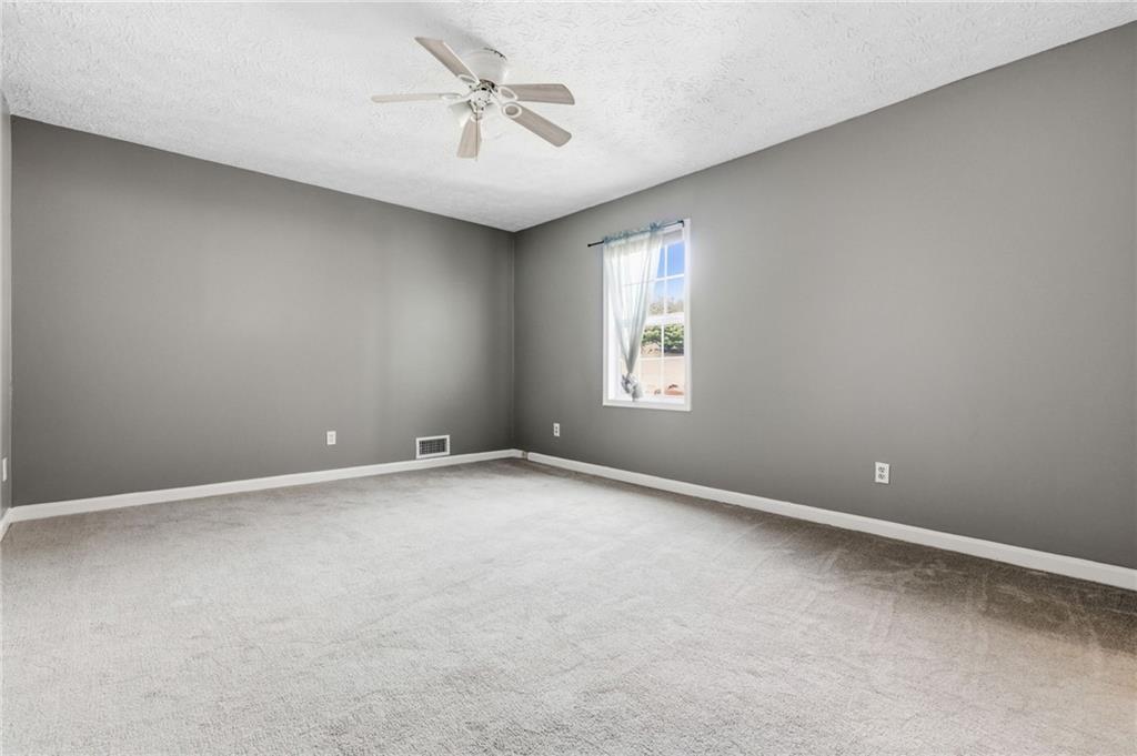 805 Manning Way Southwest Marietta, GA 30064 - Photo 18 of 27 a view of an empty room with a window