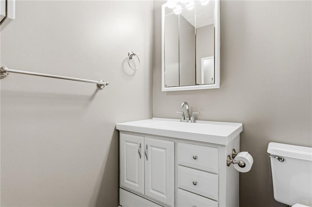805 Manning Way Southwest Marietta, GA 30064 - Photo 20 of 27 a bathroom with a sink vanity and a mirror