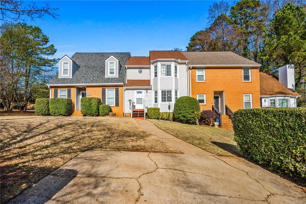805 Manning Way Southwest Marietta, GA 30064 - Photo 2 of 35 a front view of a house with a yard