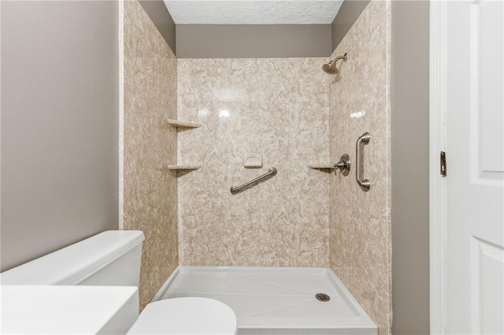 805 Manning Way Southwest Marietta, GA 30064 - Photo 21 of 27 a bathroom with a shower and toilet