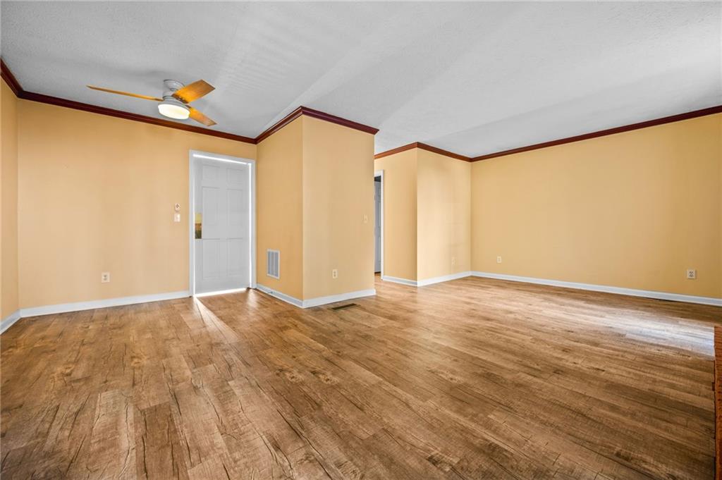 805 Manning Way Southwest Marietta, GA 30064 - Photo 24 of 35 a view of empty room with wooden floor and fan