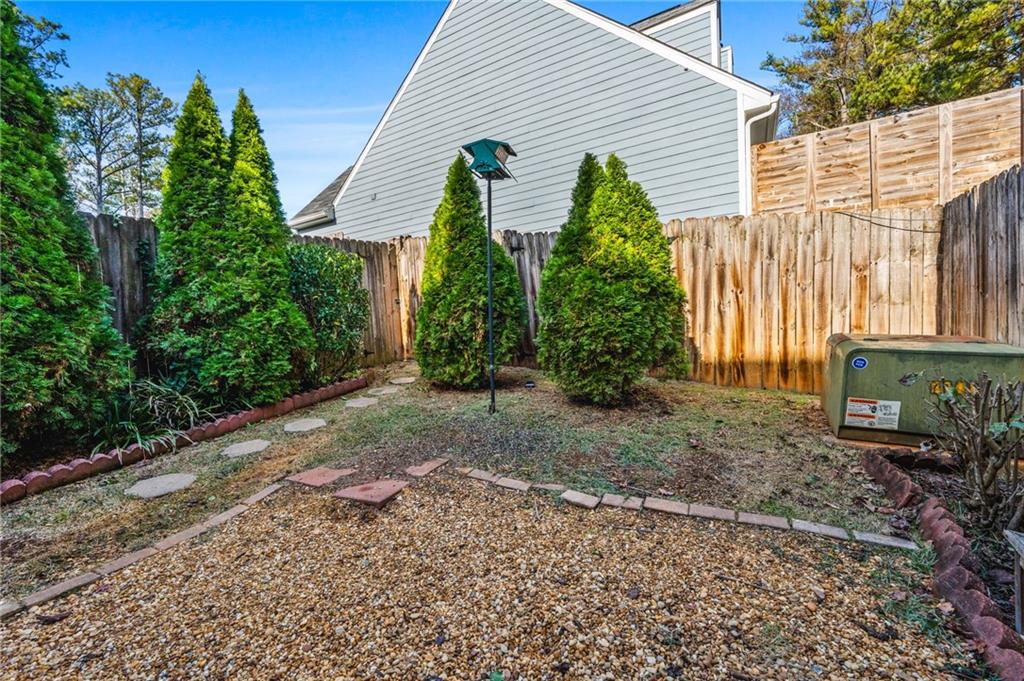 805 Manning Way Southwest Marietta, GA 30064 - Photo 25 of 27 a front view of a house with garden
